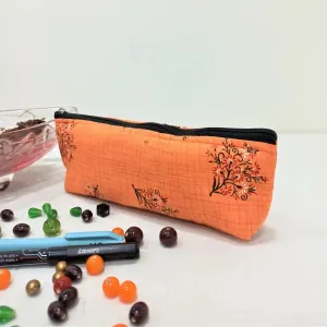 Pencil Pouches Orange with Black Flower Design.